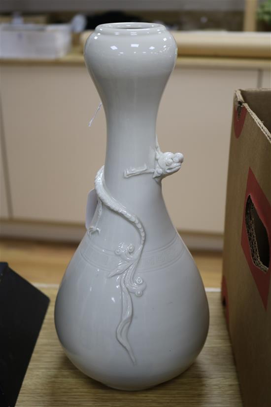 A Chinese Song-style blanc-de-chine dragon vase and a Japanese copper tray, H 30cm approx